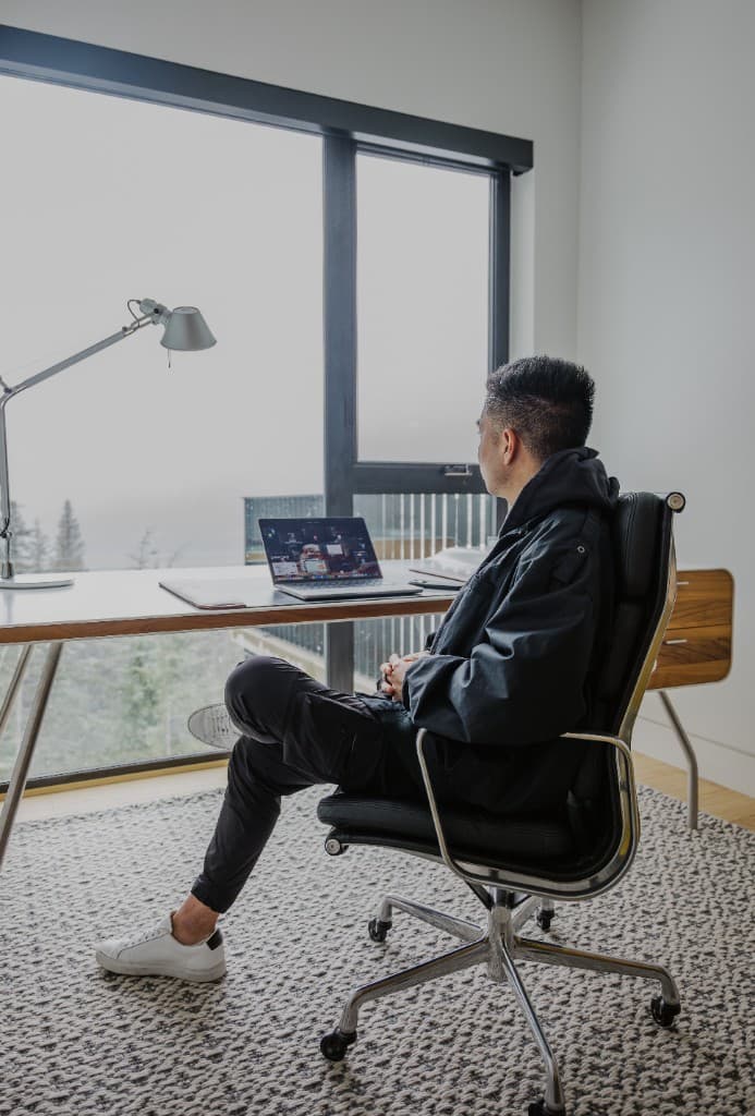 Justin Tse working from Chalet La Forja with mountain views in Kadenwood