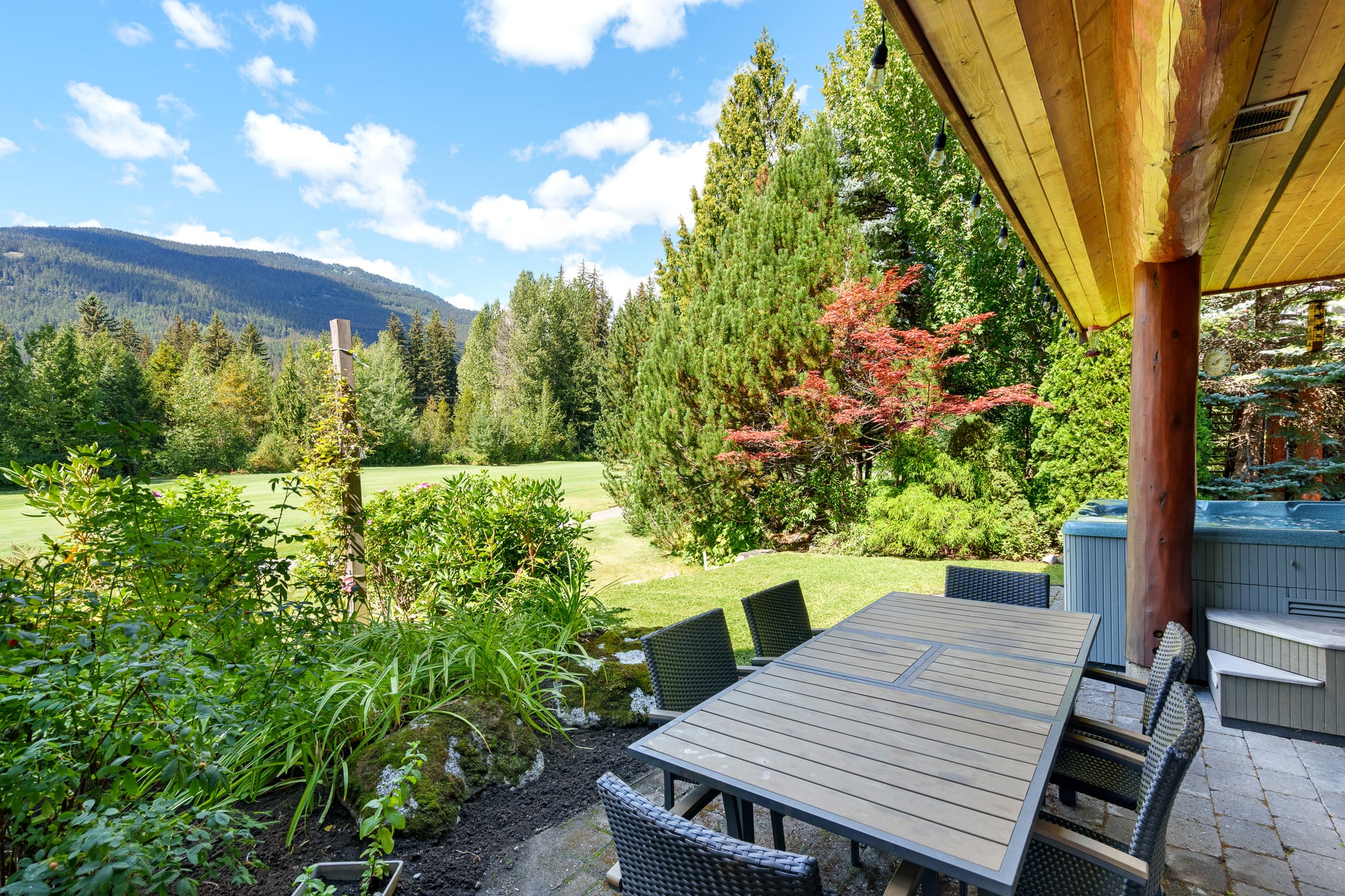 Hot tub with outdoor dining and stunning views